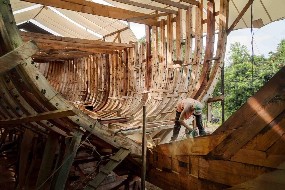 Shipwright_working_on_Stern_Deadwoods_of_Wooden_Sailing_Vessel_CEIBA.jpg